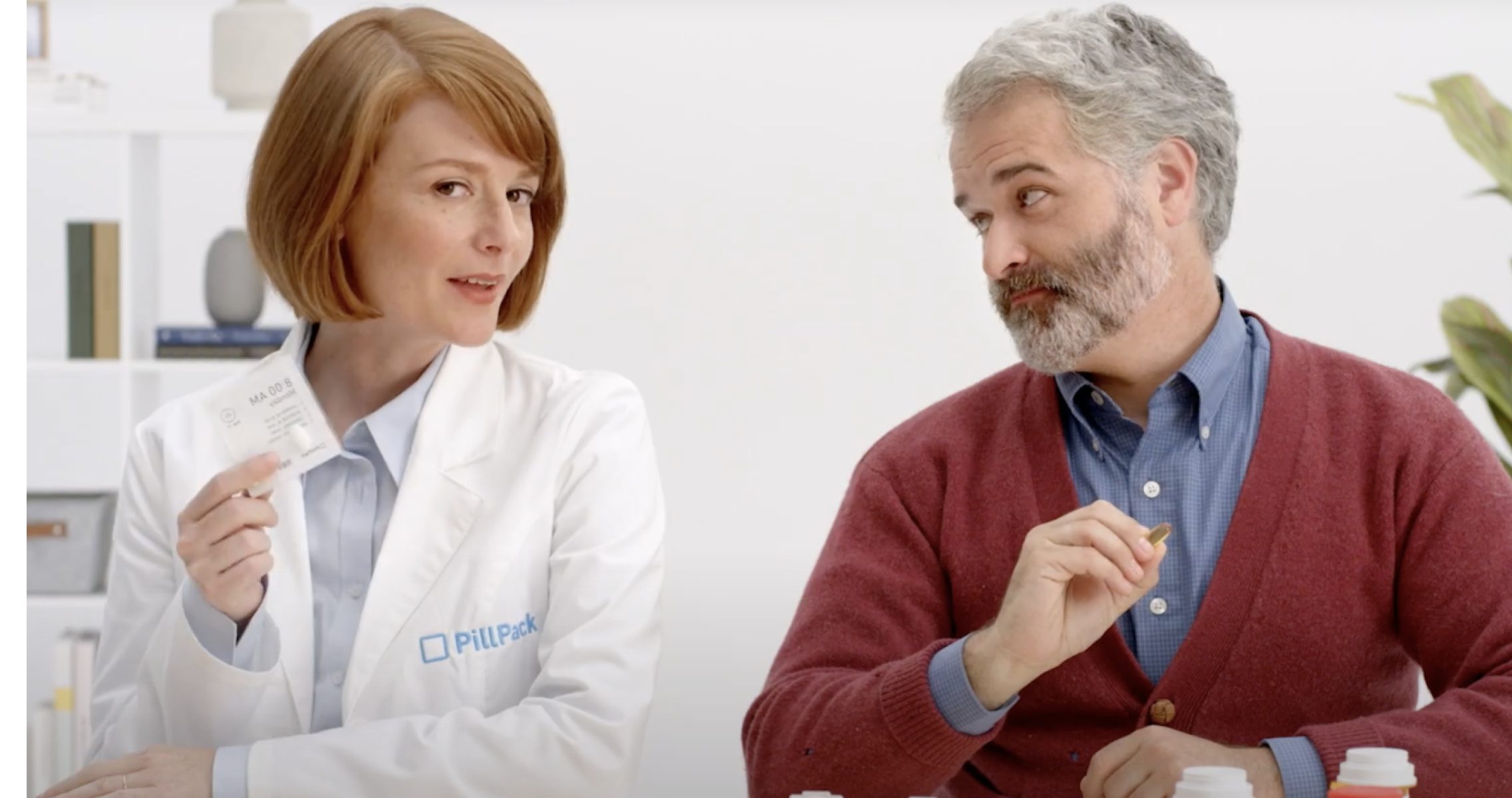 Doctor explains to patient how PillPack works to simplify prescriptions